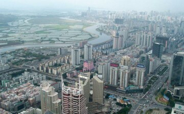 Shenzhen CBD and Mai Po marshes of Hong Kong. Photo by Karen C. Seto